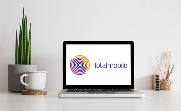 Totalmobile logo on laptop screen