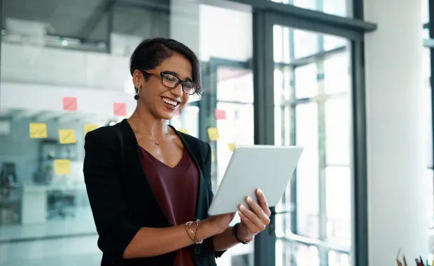 woman looking at tablet