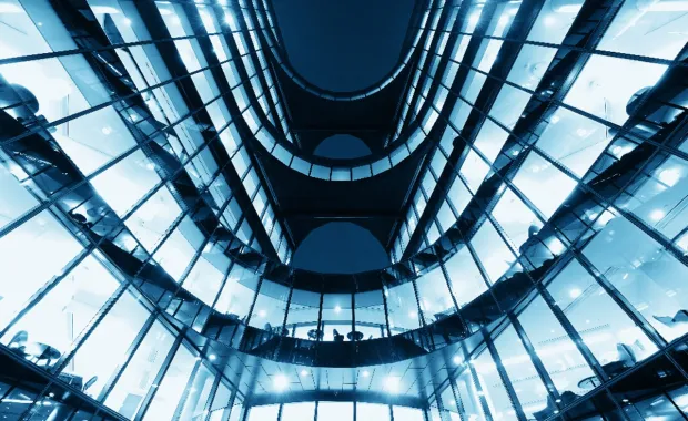 Upwards view of skyscraper lobby