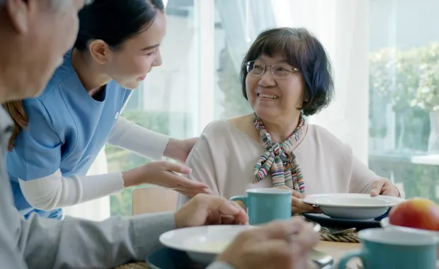 Healthcare provider assisting patients in their home