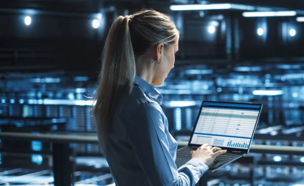 Women looking at report in her laptop