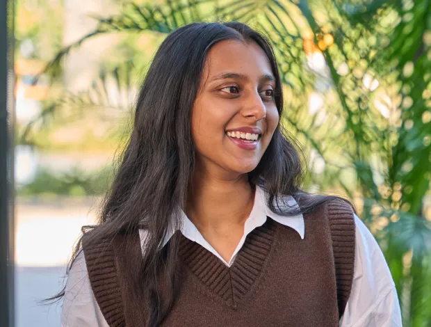 Close up shot of young man smiling directly at the camera