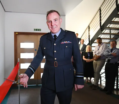 Air Vice-Marshal Tom Ashbridge cutting red ribbon at CGI Cyber Centre Air Vice-Marshal Tom Ashbridge cutting red ribbon at CGI Cyber Centre
