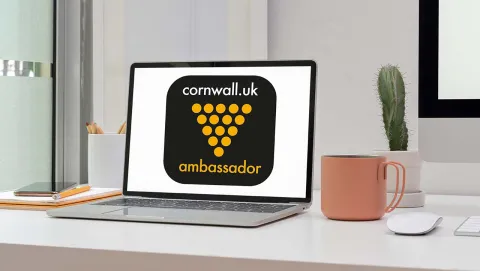 Laptop showing Cornish Ambassador logo