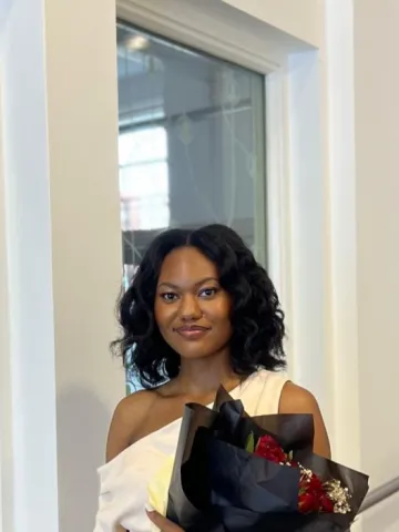 Melanie Sylvester holding flowers