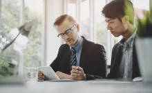 Business pProfessionals discussing strategy, symbolising CGI’s alliance with AWS Business pProfessionals discussing strategy, symbolising CGI’s alliance with AWS