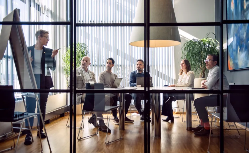 consultants brainstorming insurance strategy in boardroom consultants brainstorming insurance strategy in boardroom