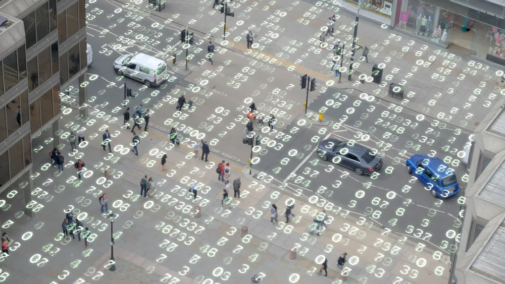 High angle shot of a London street overlaid with matrix style changing numbers.