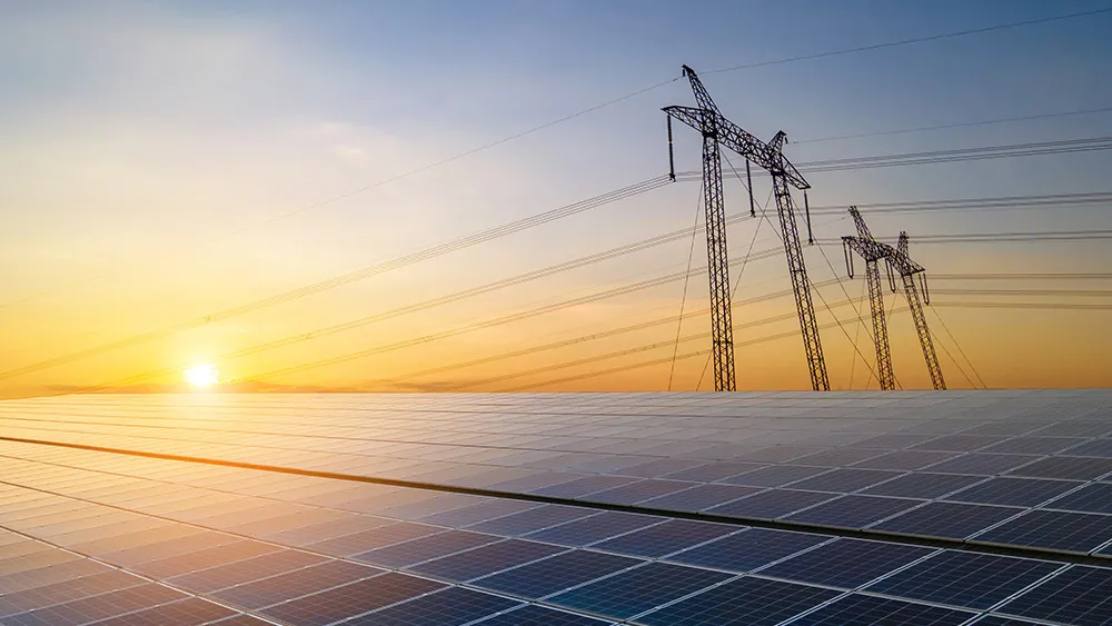power lines and solar panels - grid modernization