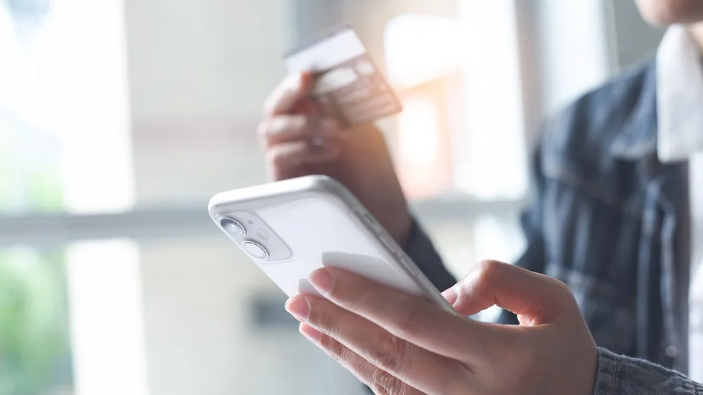 Buyer making a mobile purchase with a credit card