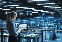 Data center IT specialist uses laptop computer