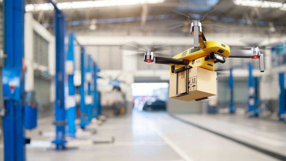 warehouse-delivery-drone-carrying-package-425480407 Warehouse drone carrying a package