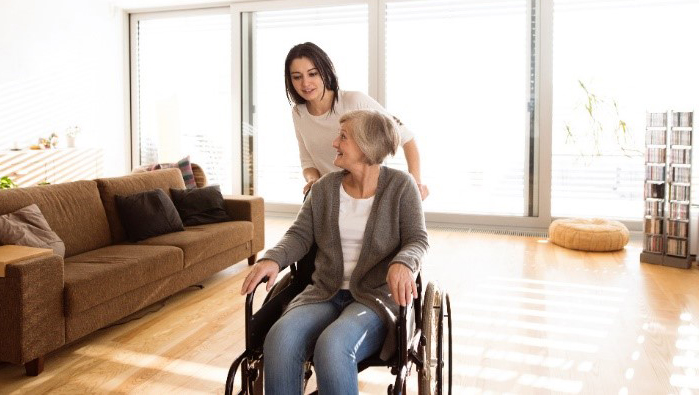 woman in wheelchair in living room