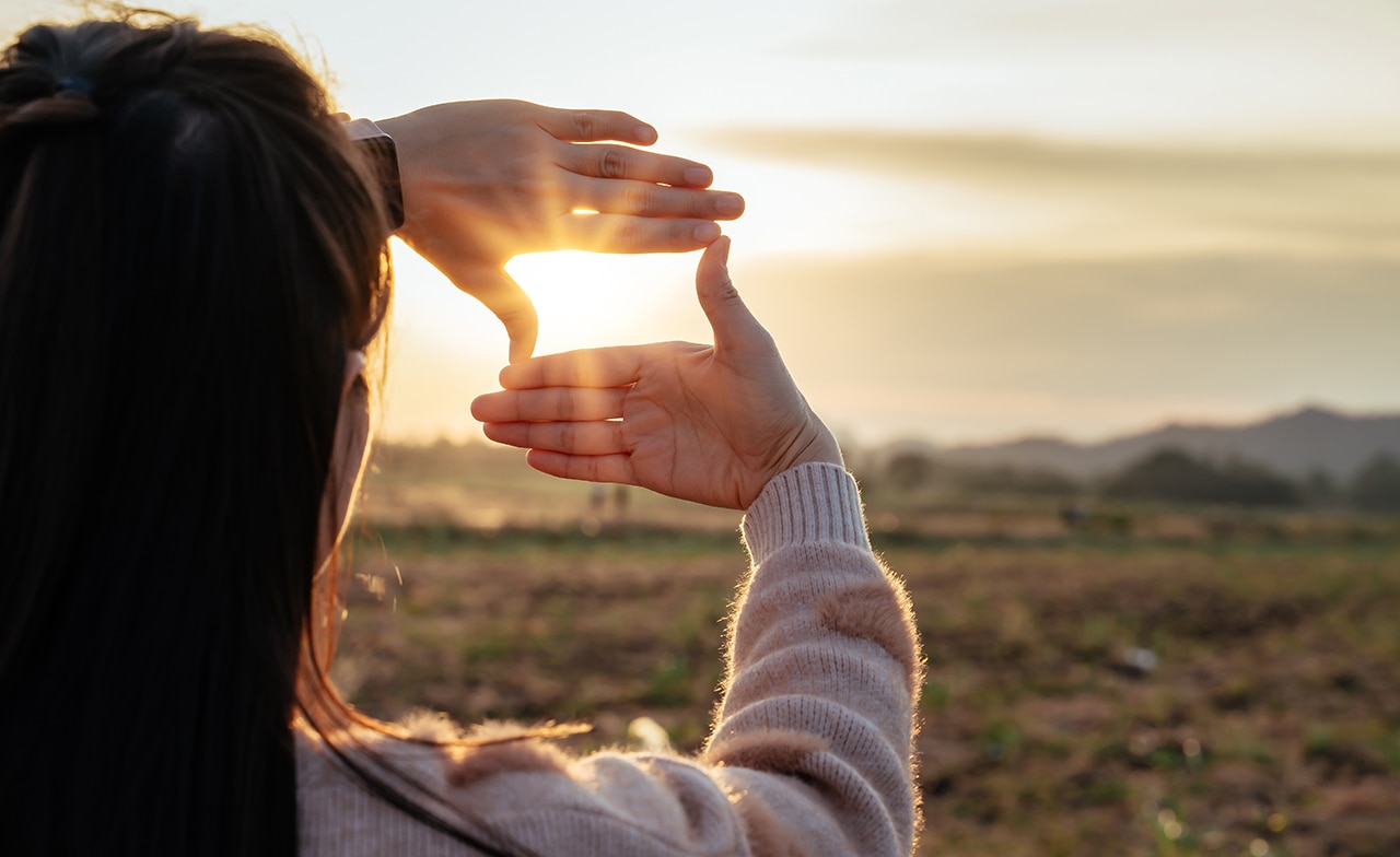 Woman viewing sunset in different angle