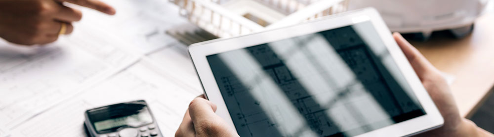 people discussing over a tablet - manufacturing rpa  people discussing over a tablet - manufacturing rpa