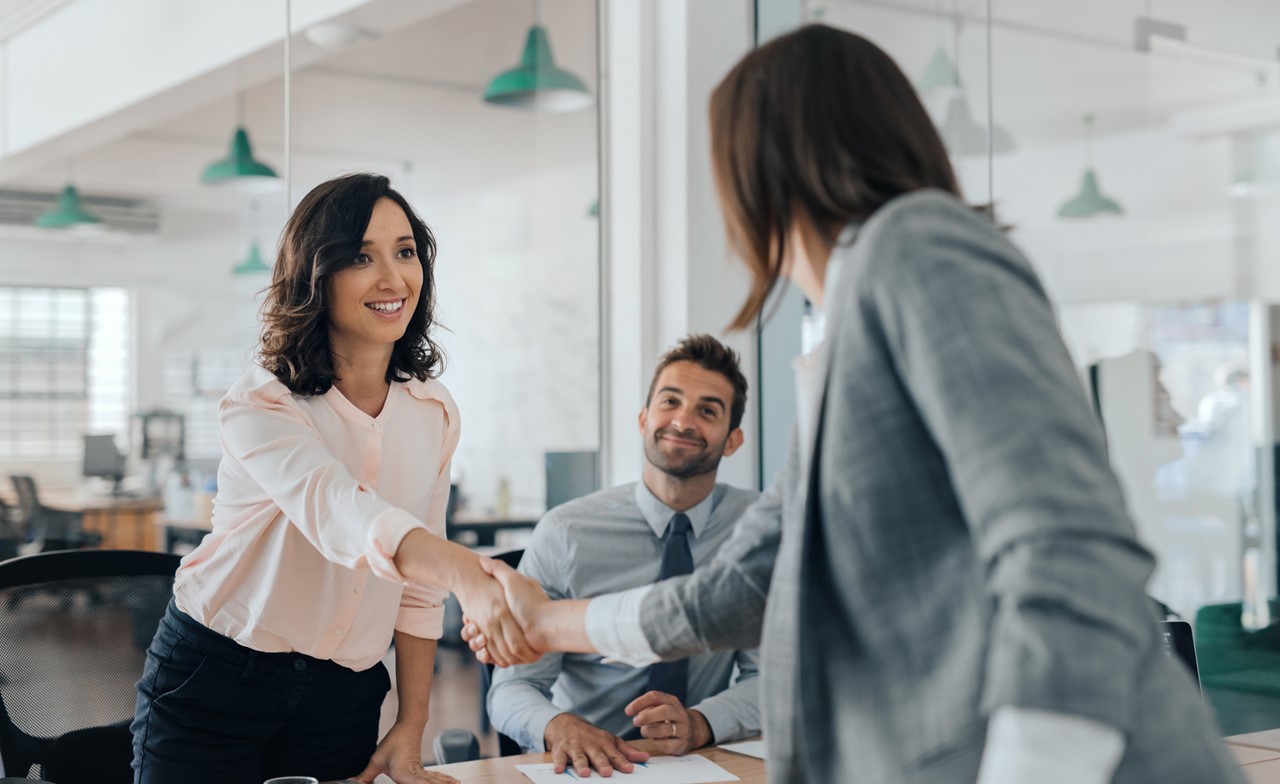 consultants-sharing-hands-288572603 Consultants shaking hands
