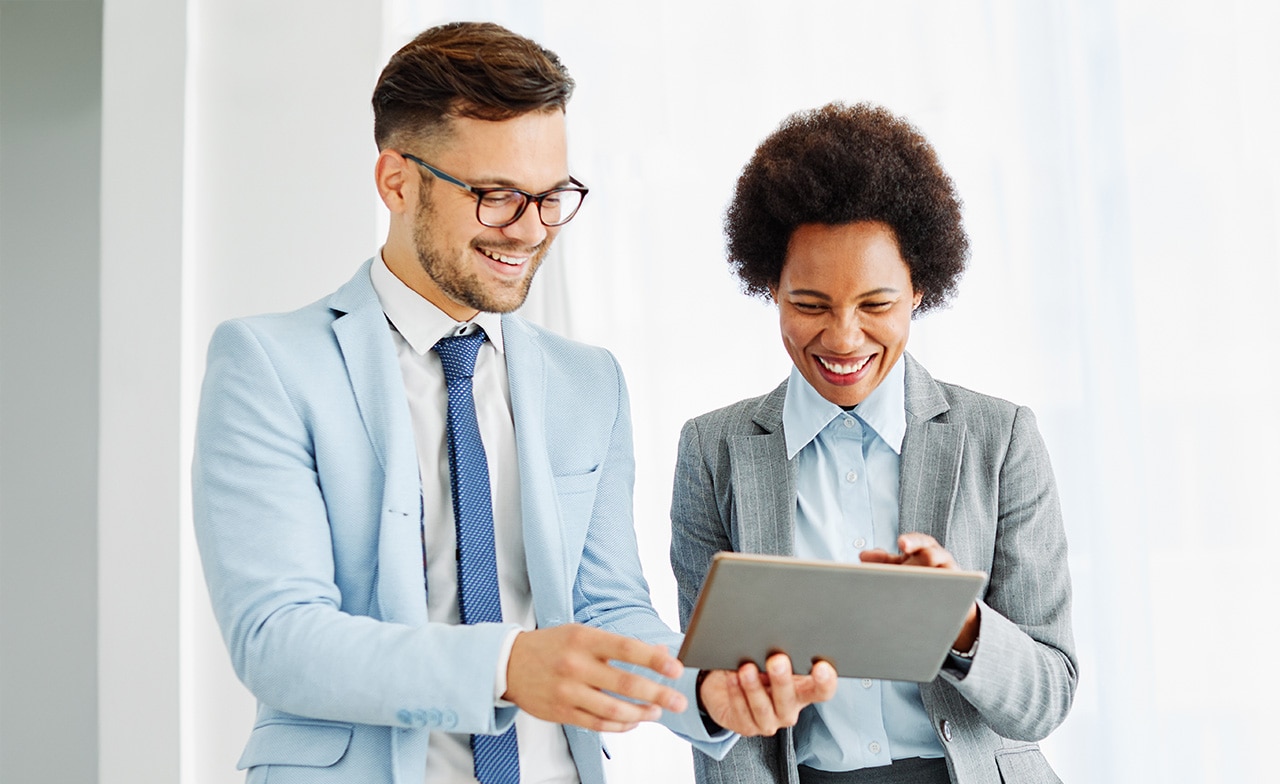 Consultants discussion business with a tablet Consultants discussion business with a tablet