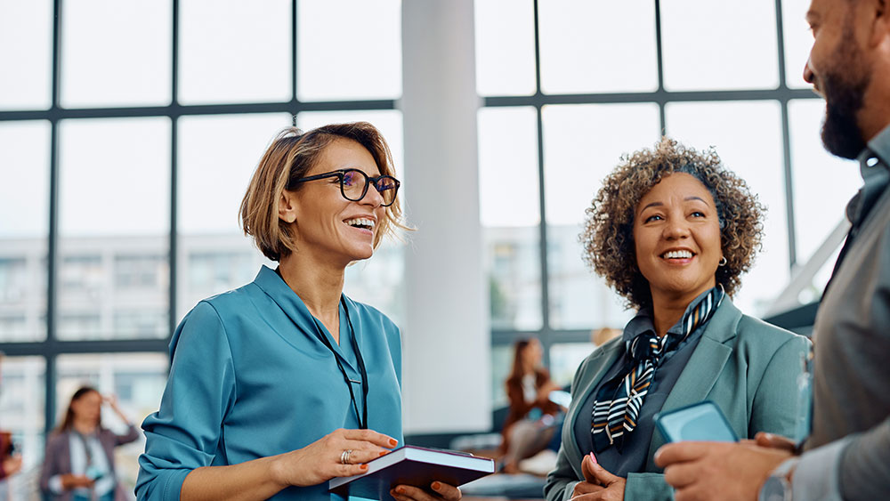 Three persons discussing alt