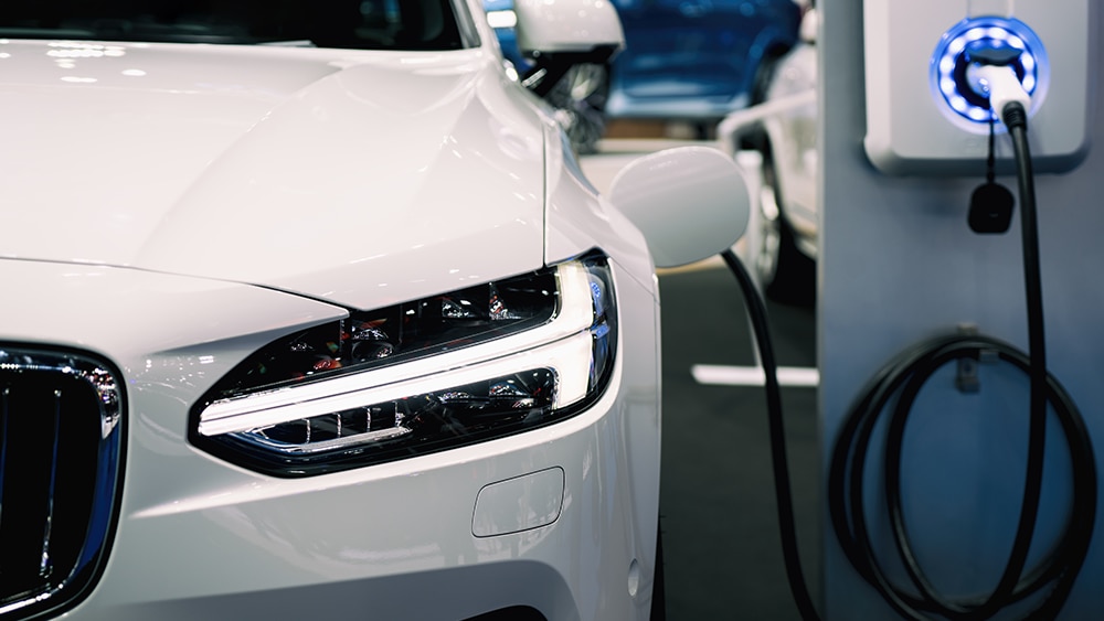 Hybrid car at a fueling station