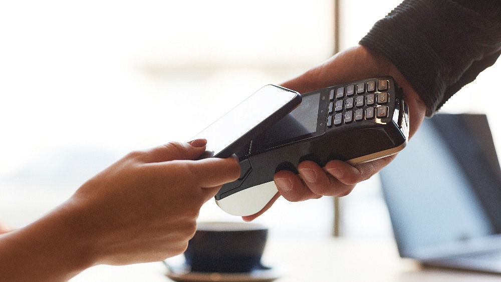 person using contactless pay