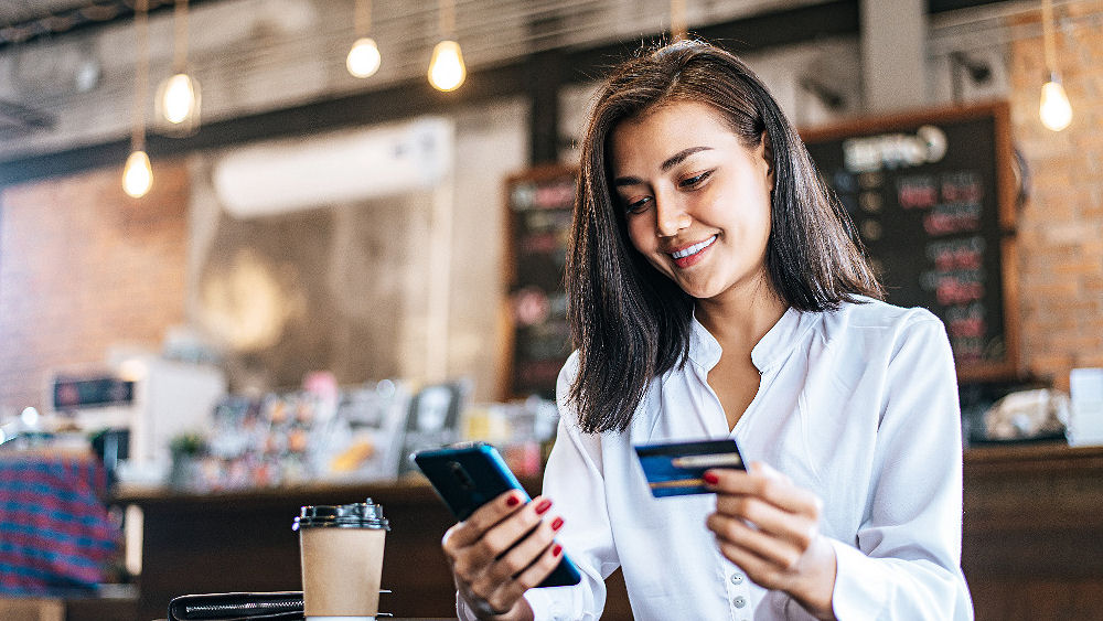 woman purchasing on mobile phone