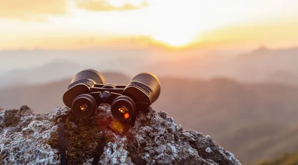 binoculars on a cliff