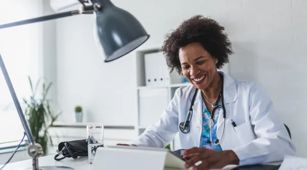 Healthcare looking at tablet in office