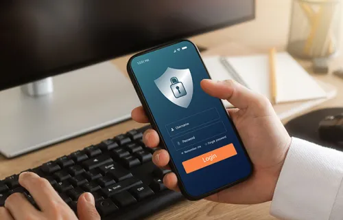 someone holding a cell phone with a lock on it