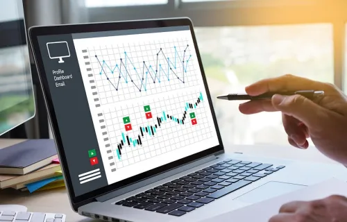 Businessman reviewing data on a laptop