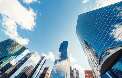 View of buildings and clouds from the ground 