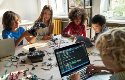 A group of children building robotics