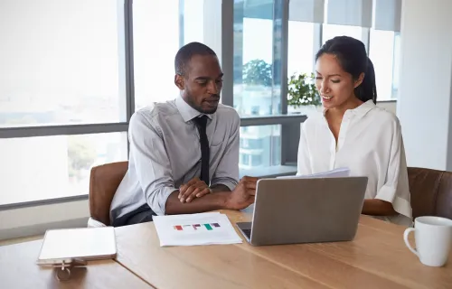 Consultants looking at a laptop