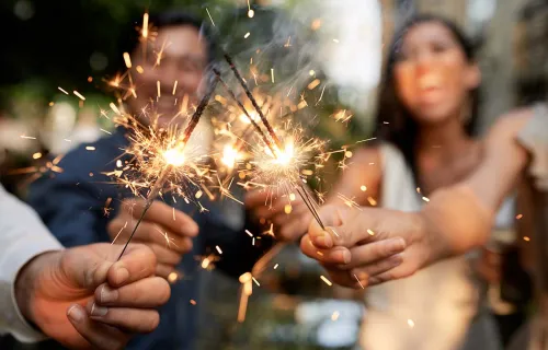 Friends celebrating with sparklers