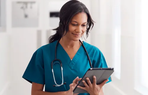 Health worker holding tablet device