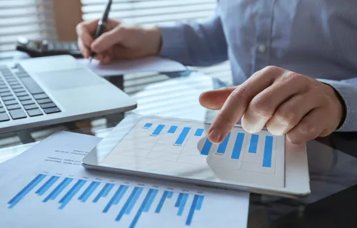 Payroll employee working on graphs