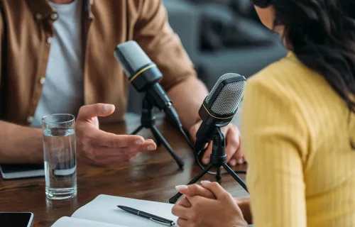 Two people recording a radio show