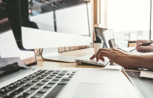 person typing on keyboard