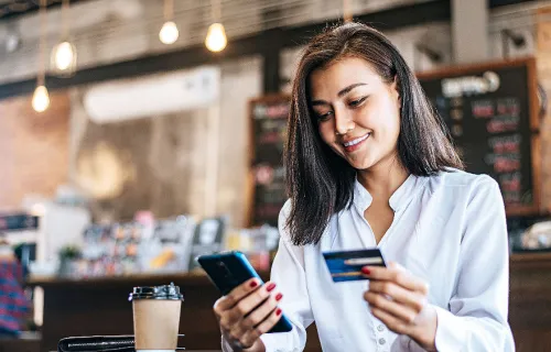 Payments - woman at desk looking at laptop