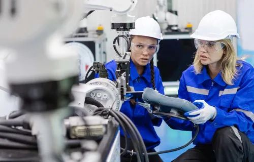 female engineers using remote automation robotics digital factory