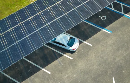 car in parking lot with solar roof