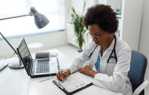 A life sciences professional working at a desk
