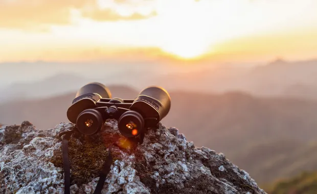 binoculars on a cliff