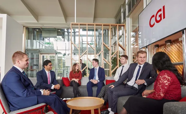 CGI professionals chatting in an office lounge