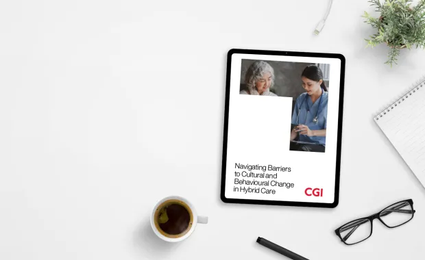CGI Hybrid care whitepaper displayed on a tablet on busy desk