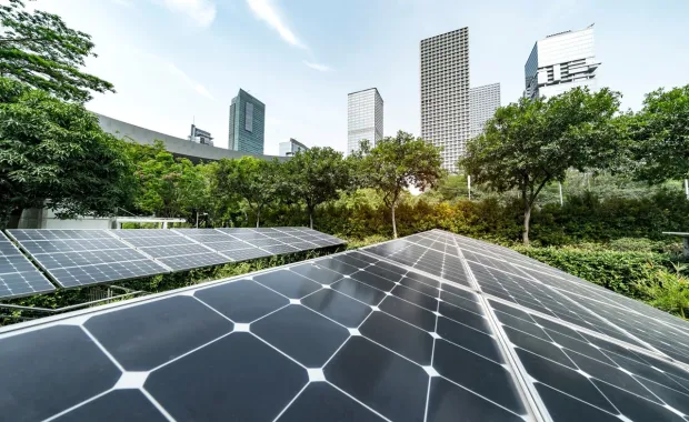close-up of solar panels with building in the background