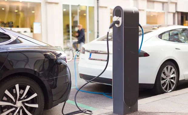two electric vehicles charging