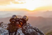 binoculars on a cliff