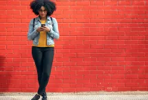 Woman standing with phone