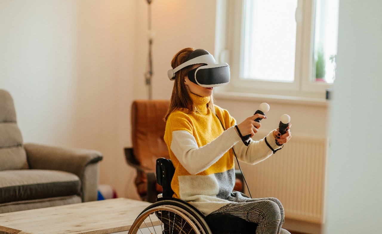 Woman in wheelchair using VR headset Woman in wheelchair using VR headset